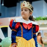 Child dressed as a princess during themed celebration at Piccoli indoor play area.